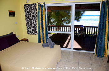 bed of the Studio Unit and view of the lagoon