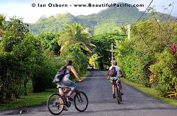 backpackers cycling on Rarotonga Island